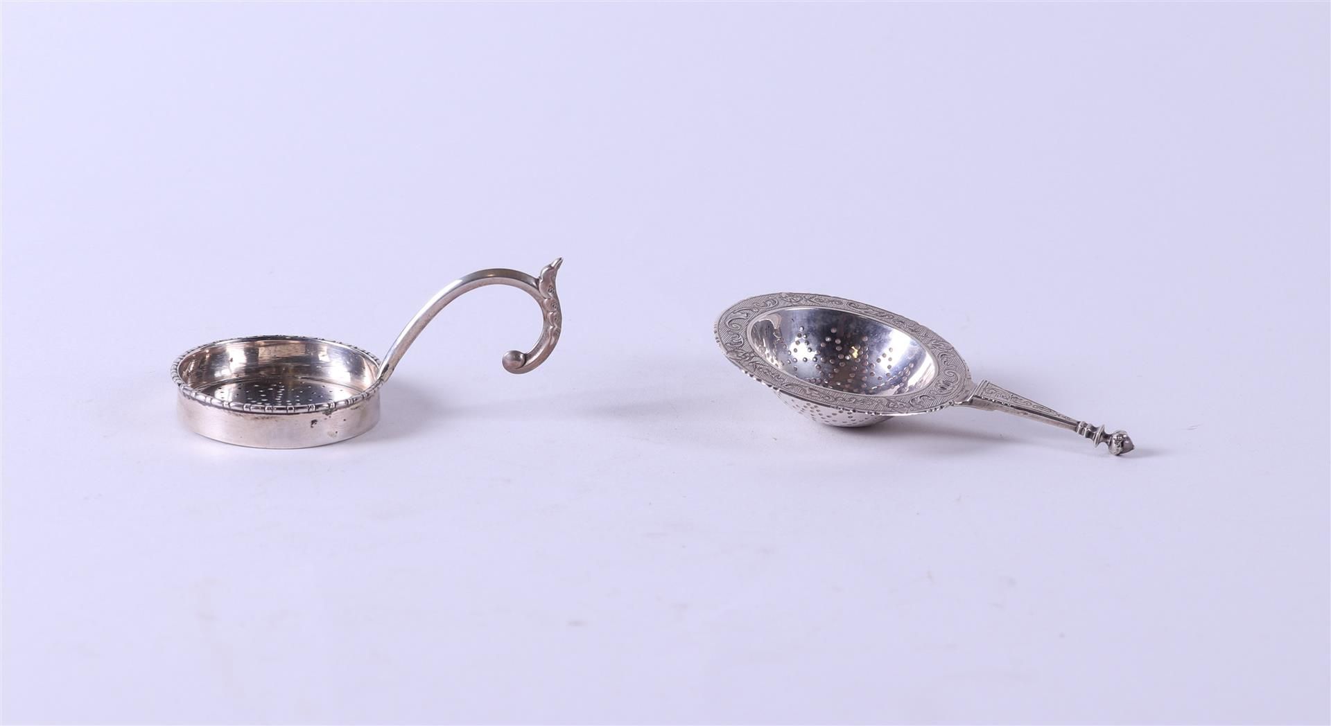 A lot of two tea strainers. Silver 68 gr.