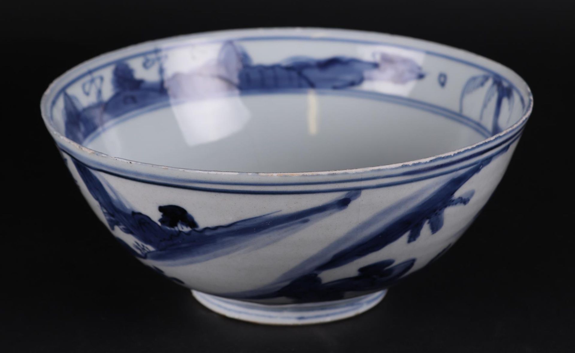 A porcelain bowl with landscape decor. China, Wanli.