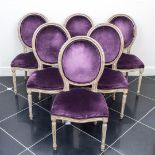 A lot consisting of (6) medallion-back chairs upholstered in purple velvet.