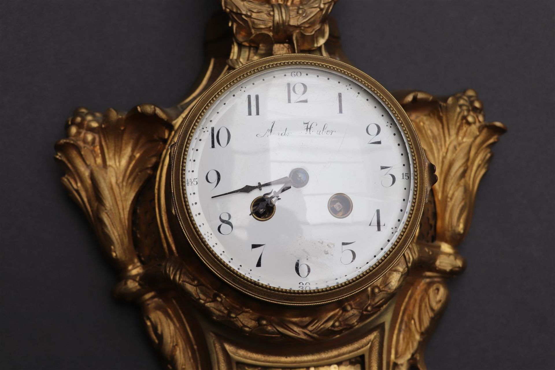 An ormolu plated cartel clock decorated with vase work and garlands, France late 18th century. - Image 2 of 4