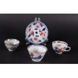 Three various porcelain Imari bowls, all with floral decor, one with ear, and a saucer. China,