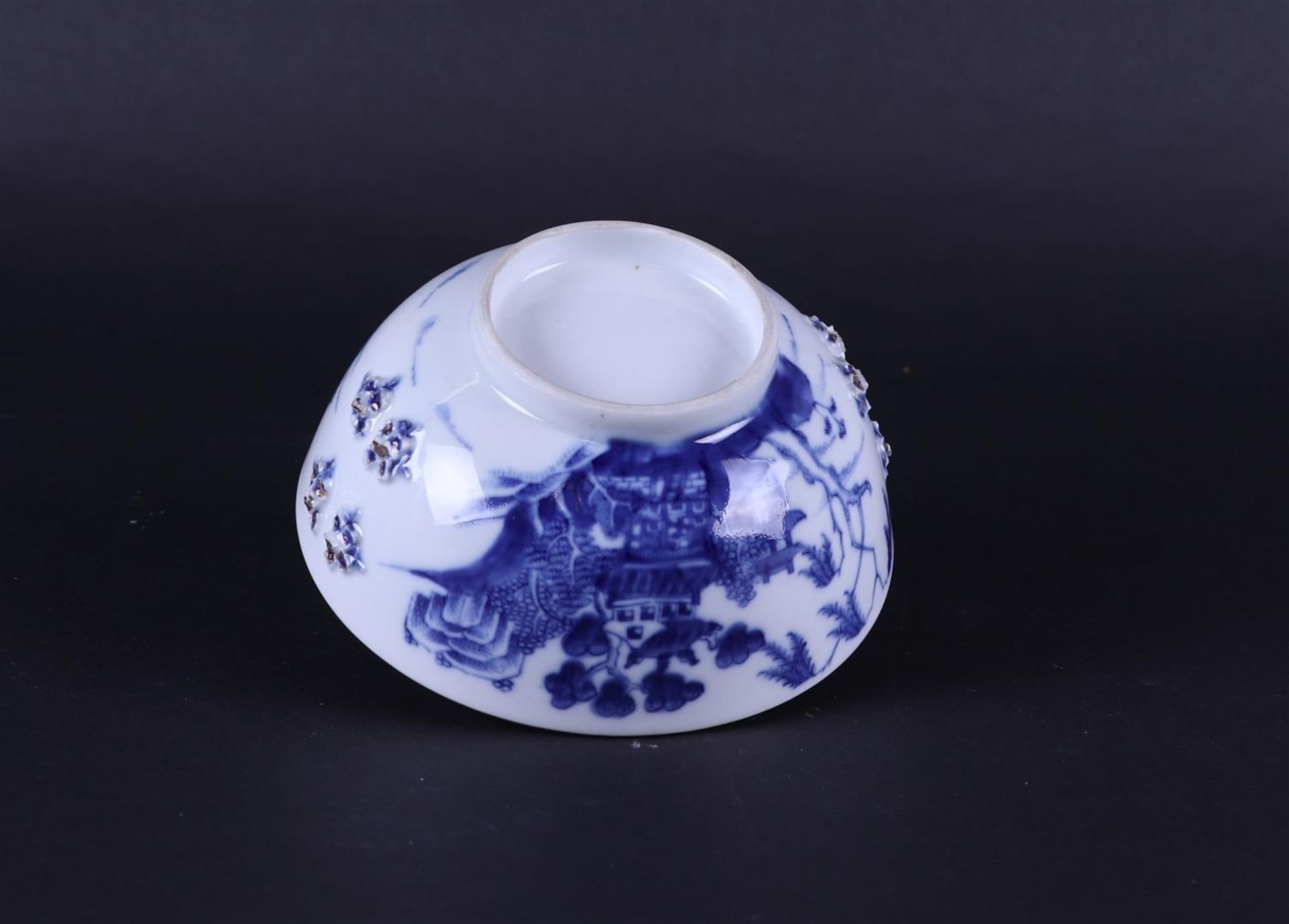 A porcelain bowl with river landscape decor on the outside and embossed flowers on the outside.  - Image 5 of 5