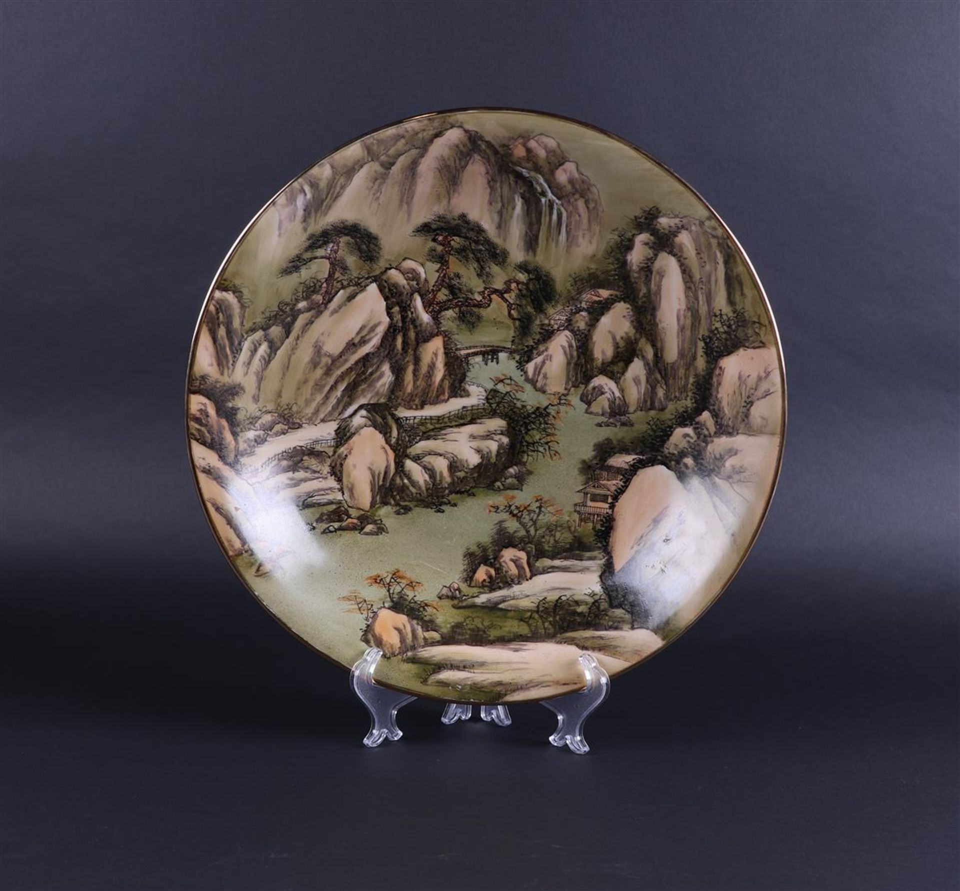A large porcelain dish decorated with a Chinese Landscape. China, 20th century.