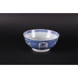 A porcelain bowl with a lotus leaf outer rim, filled with floral decor,
