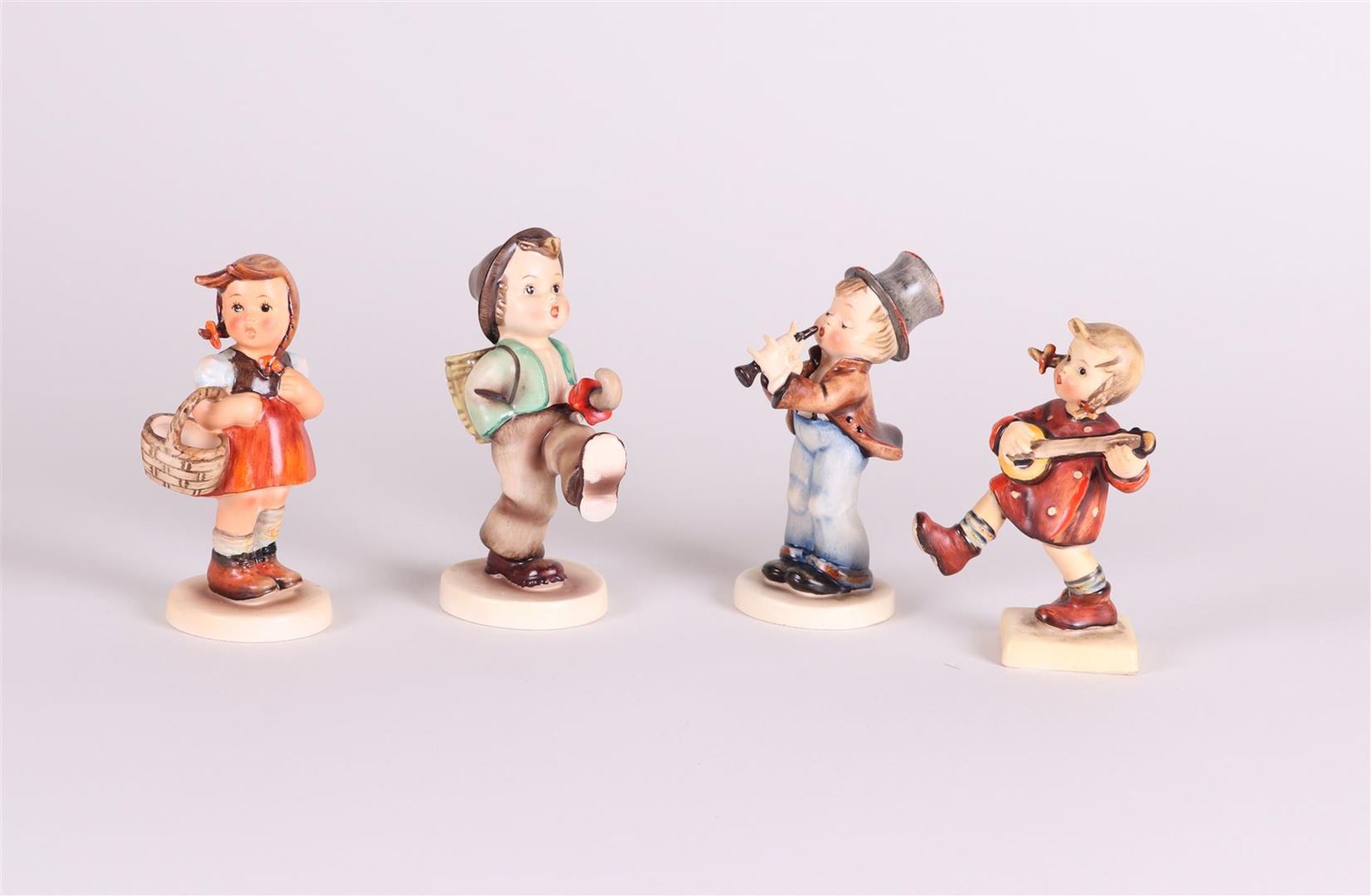 MI. Hummel, a lot of (4) figurines, all marked Goebel.