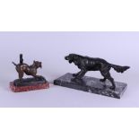 A lot of two zamac dogs on a marble base. Circa 1900.