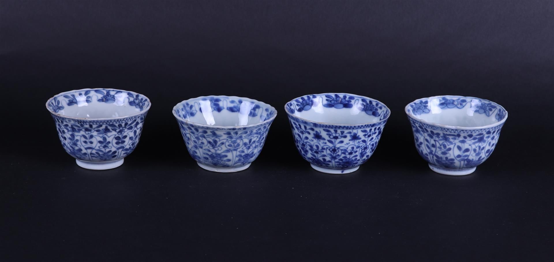 Four contoured porcelain bowls with floral decoration in flower-shaped compartments