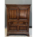 A chestnut wood china cabinet, after an older example. In very good condition.