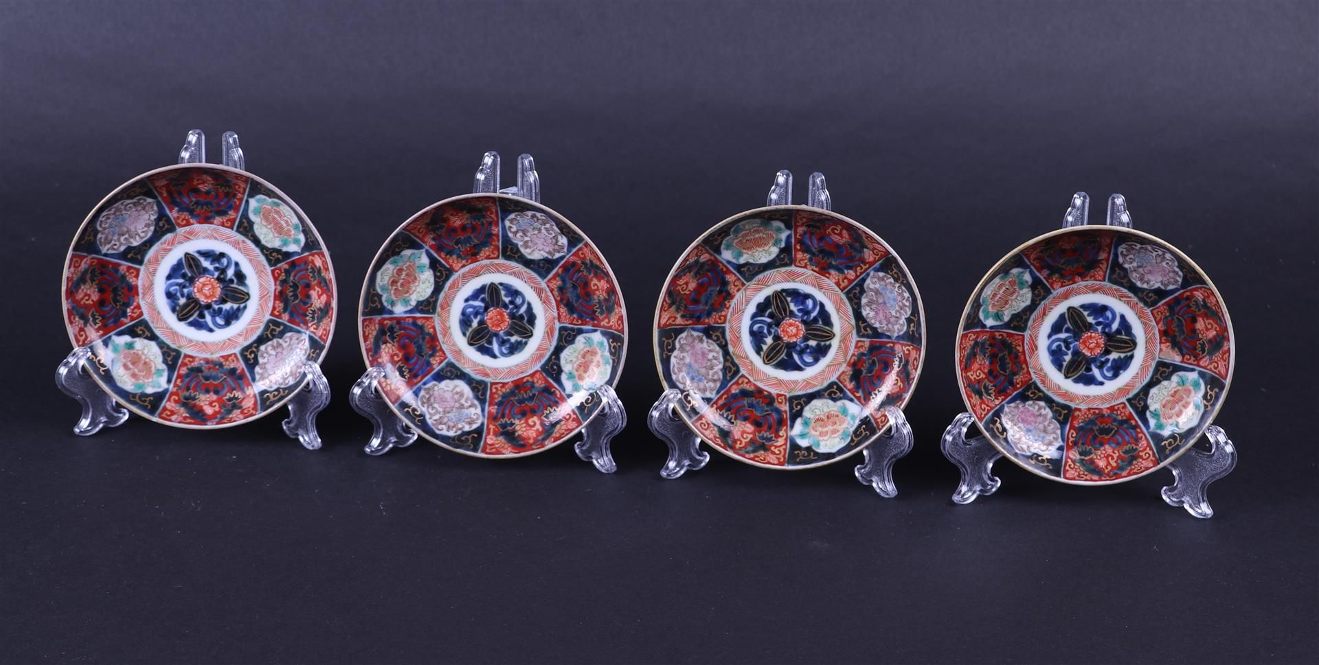 A set of four porcelain Imari plates. Japan, circa 1800.