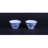 Two ribbed porcelain bowls with floral decor in borders, the inside also with floral decor.