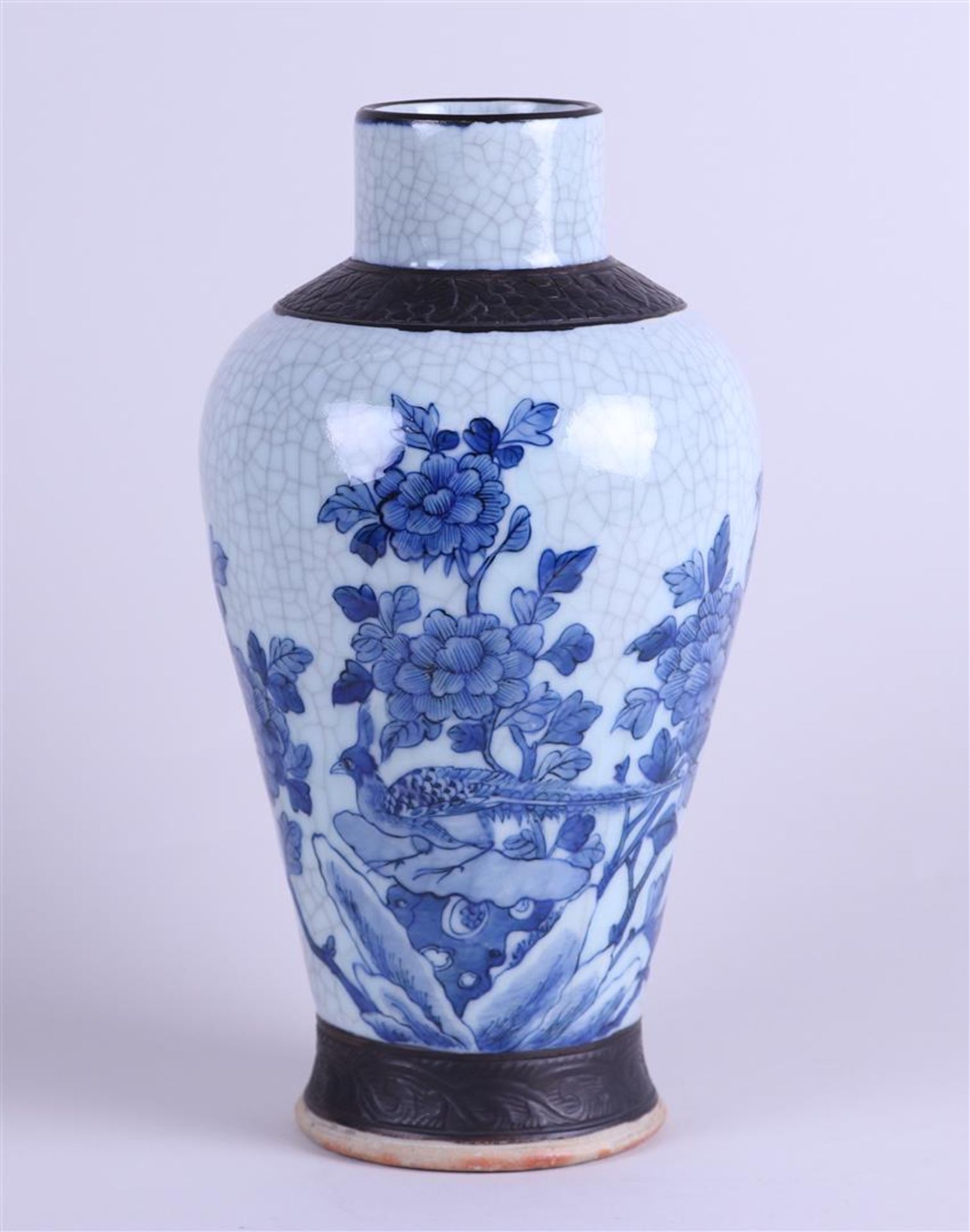A Nakning pottery vase decorated with pheasant and flowers. China, circa 1900.