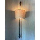A set of (2) antique curtain rods made into wall lamps.