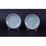 Two Celadon dishes with seal mark on the bottom. China, Ming and later.