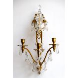 A set of two bronze wall chandeliers with glass icicles