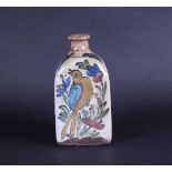 A Qajar pottery bottle decorated with decor of animals and plants. Persia, 19th century.