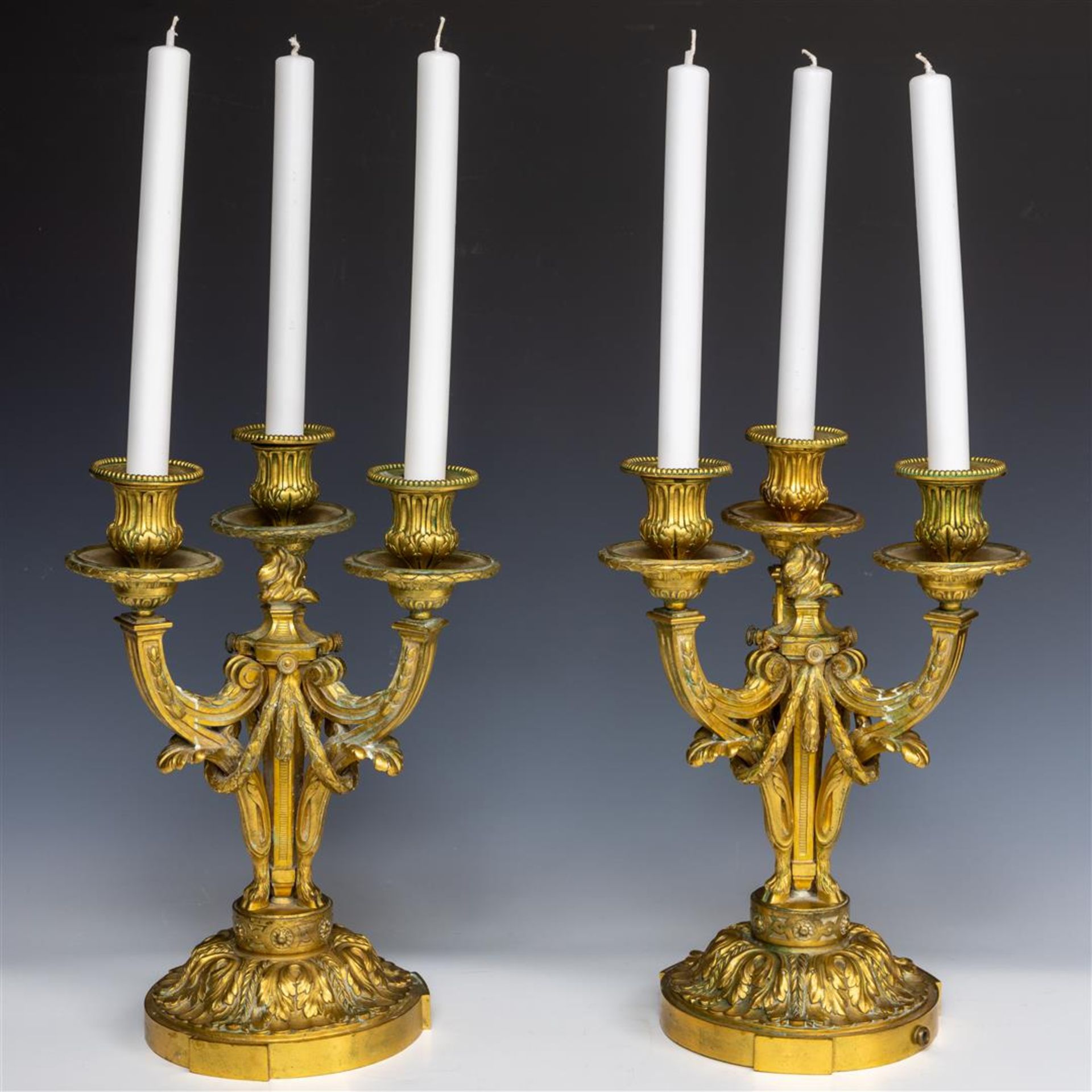 A pair of French bronze three-armed candlesticks, 19th century. - Image 2 of 2