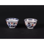 Two porcelain Imari bowls with refined floral decoration, with butterflies. China, Kanxi.
