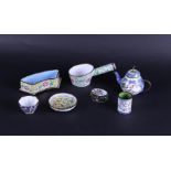 A lot of various enamel including lidded boxes and a teapot. China, 20th century.
