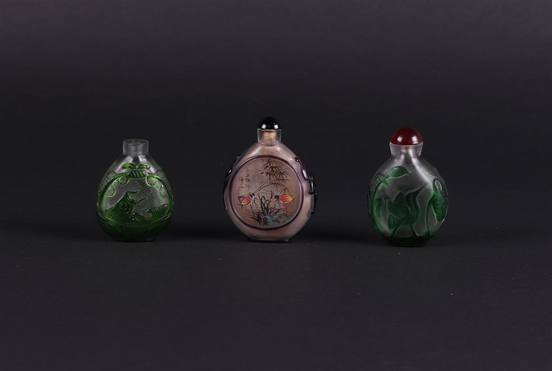 A lot  with  (3) snuff bottles, some in glass. China, 20th century.