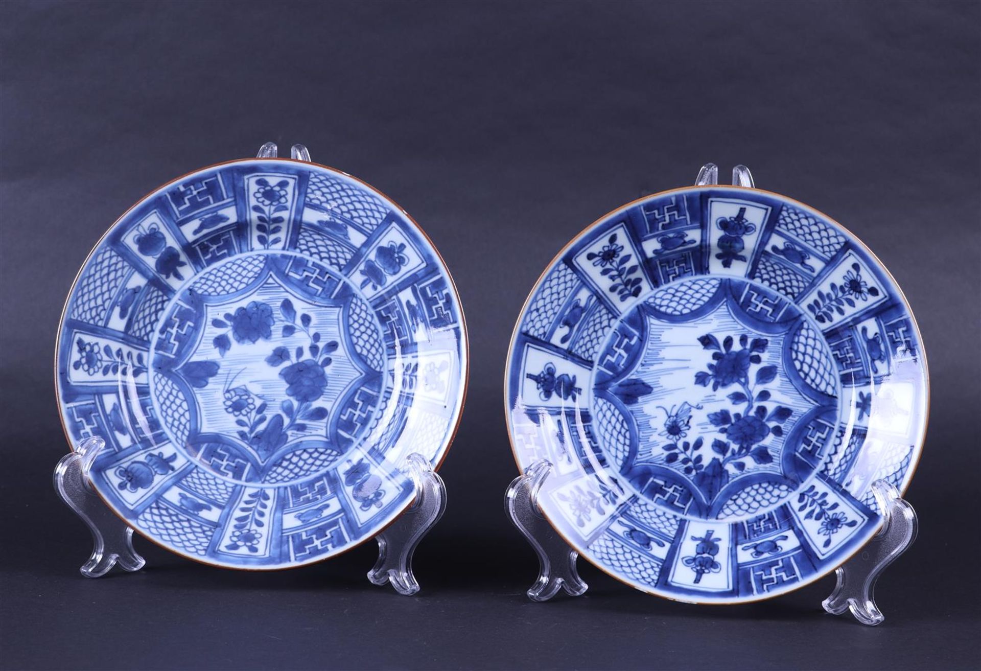 Two porcelain dishes with compartments on the rim, with amongst others.