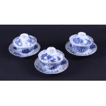 A set of three blue and white lidded cups and saucers, marked. Japan, 19th century.
