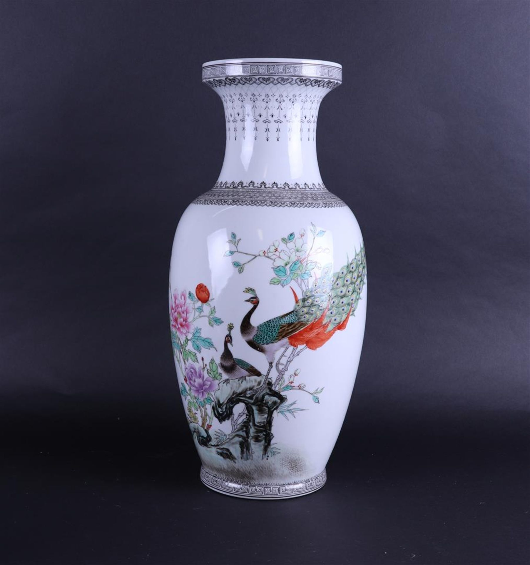 A large porcelain vase in Famile Rose decor with peacocks and flowers. China, 20th century.