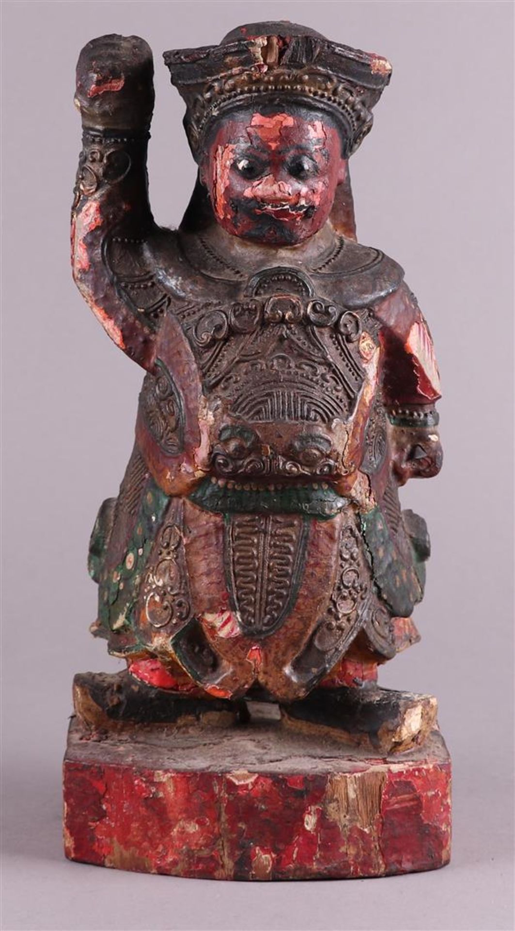 A wooden sculpture of a temple guard. Tibet, circa 1900.