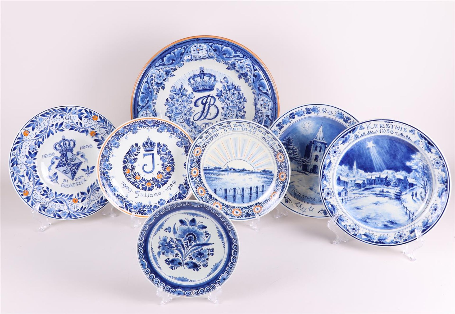 A lot of seven earthenware dishes and plates, all marked "De Porcleyne Fles".