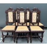 A set of (11) richly carved oak Neo Renaissance dining room chairs with fabric seat.