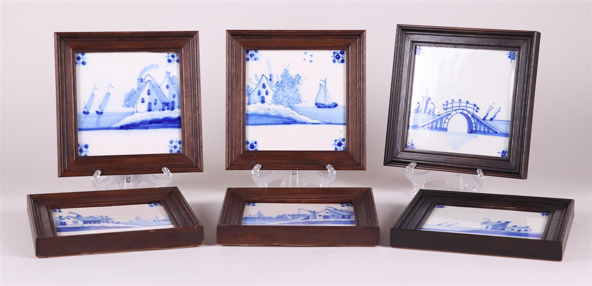 A lot  with (6) framed pottery tiles. Delft, 19th century.