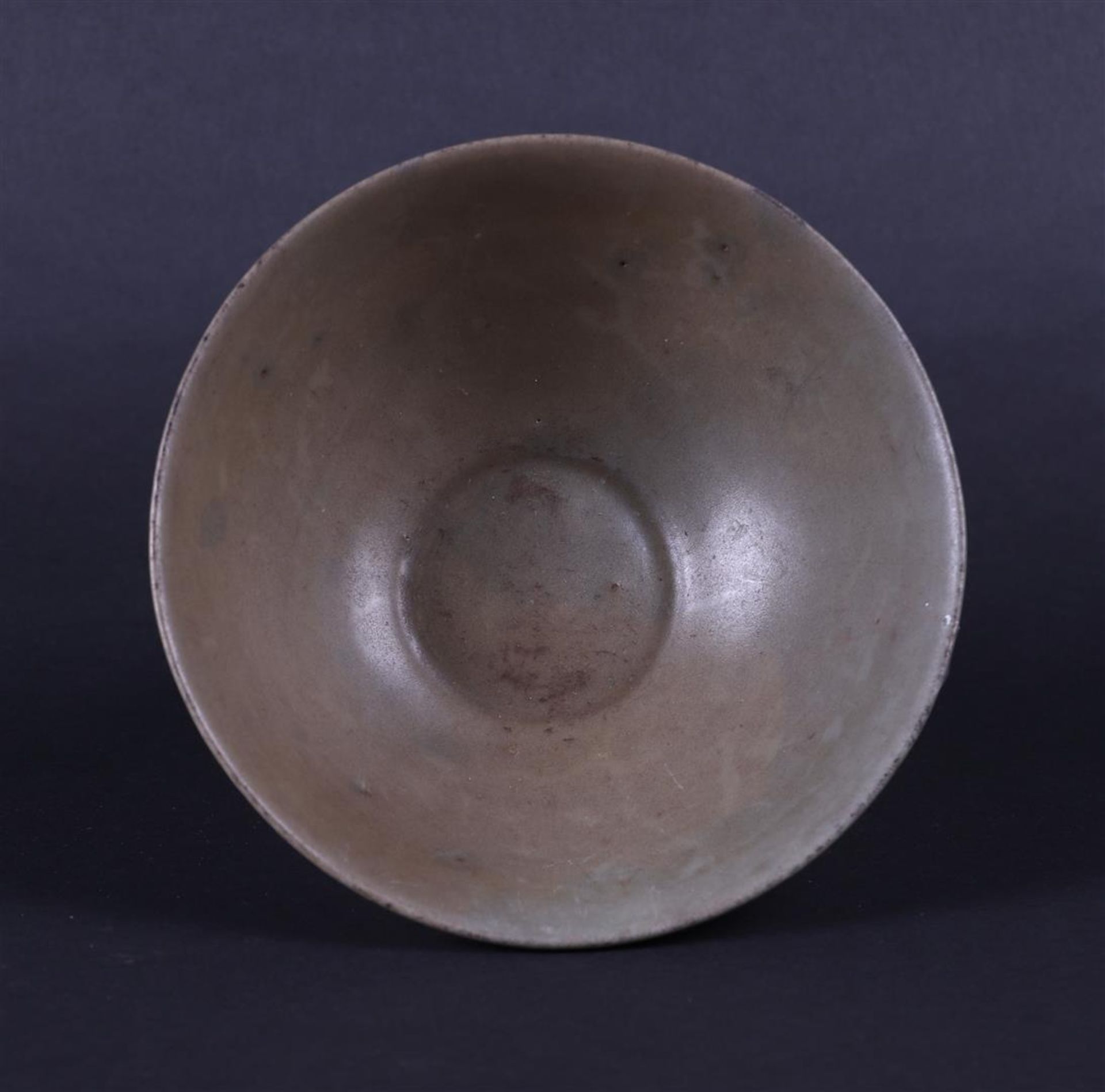 A celadon bowl with lotus relief. China, Yuan. 