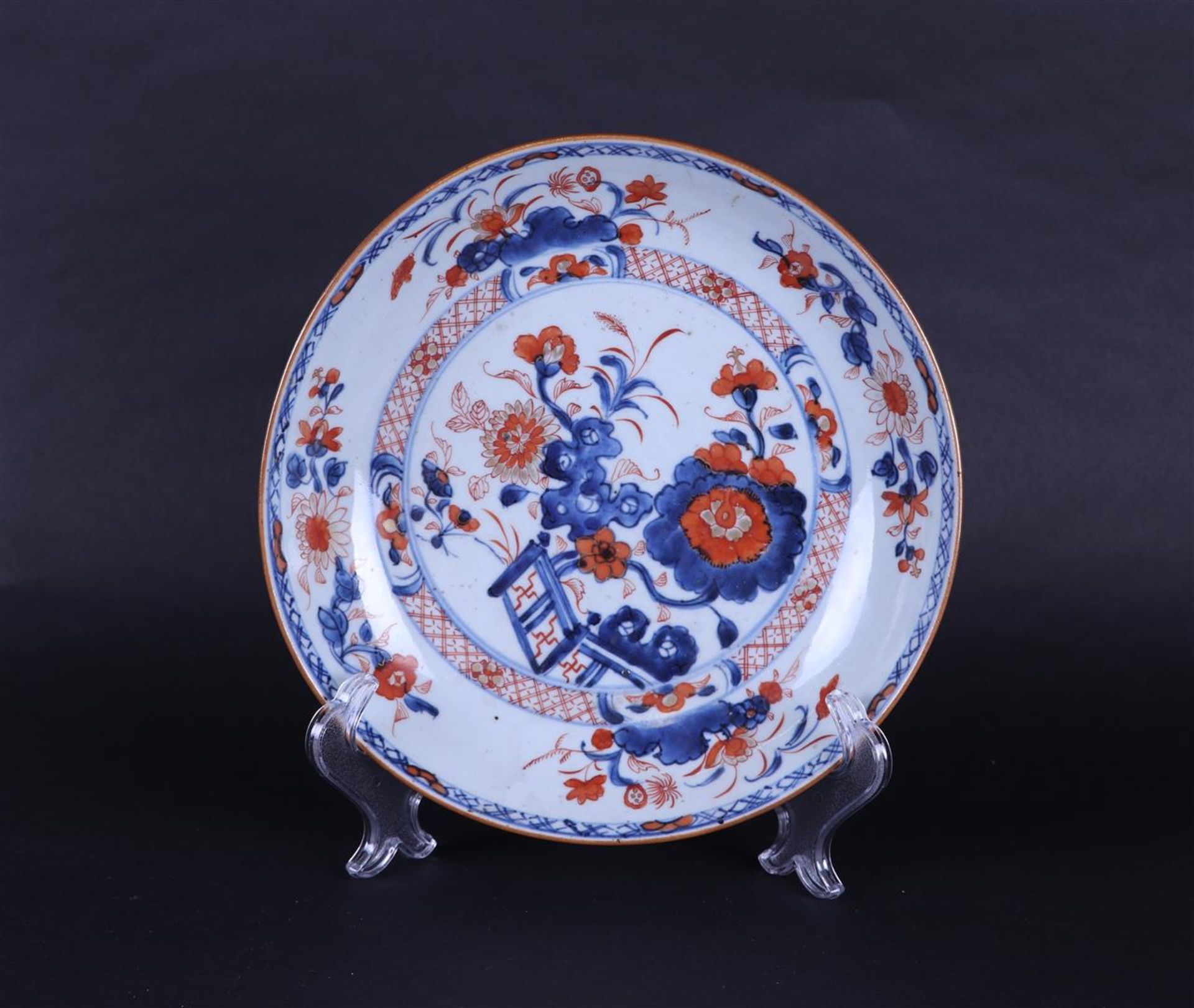 A porcelain Imari deep plate. China, Qianlong.