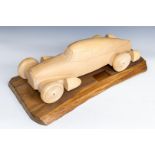 A wooden carving depicting Auto Union silber pfeil, prize for Cours d'elegance, 2007.