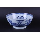 A porcelain bowl with a rich decoration of a river landscape on the outside