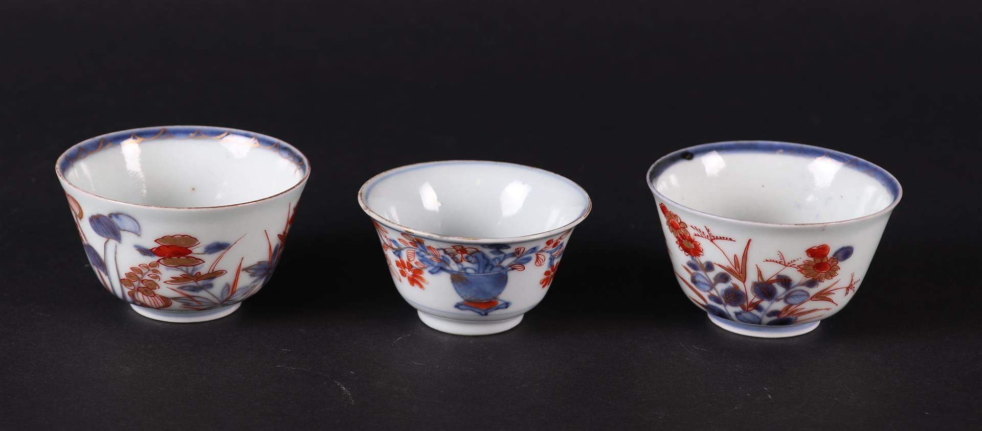 Three  different porcelain Imari bowls with lotus decor, and with flower basket decor. 