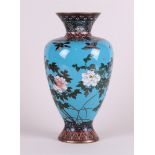 A blue bronze cloisonée vase depicting peonies, Japan, Meiji period (1868 - 1912).