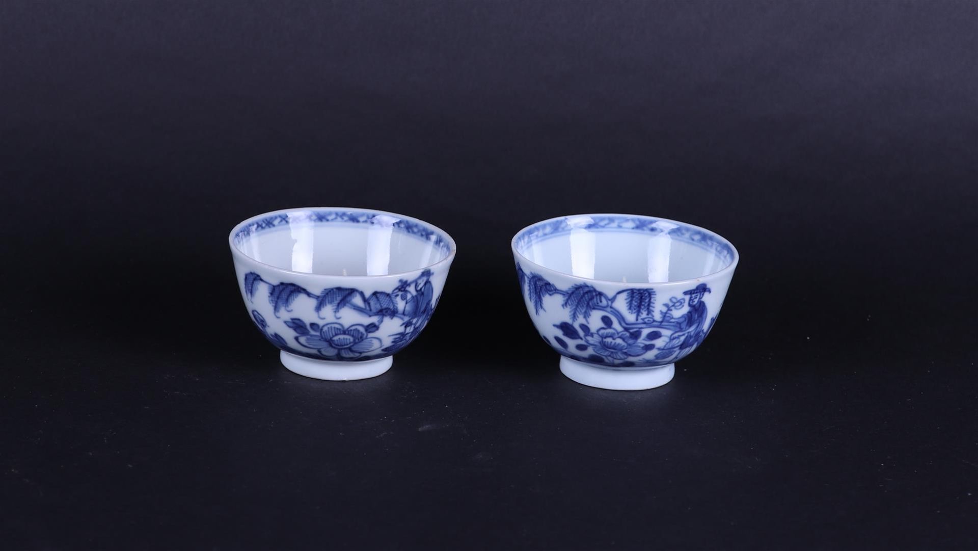 Two porcelain bowls with a landscape decor  and a standing sage by a weeping willow. 