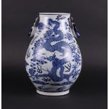 A porcelain 'Hu' vase decorated with dragons and deer heads, marked Guangxu. China, 20th century.