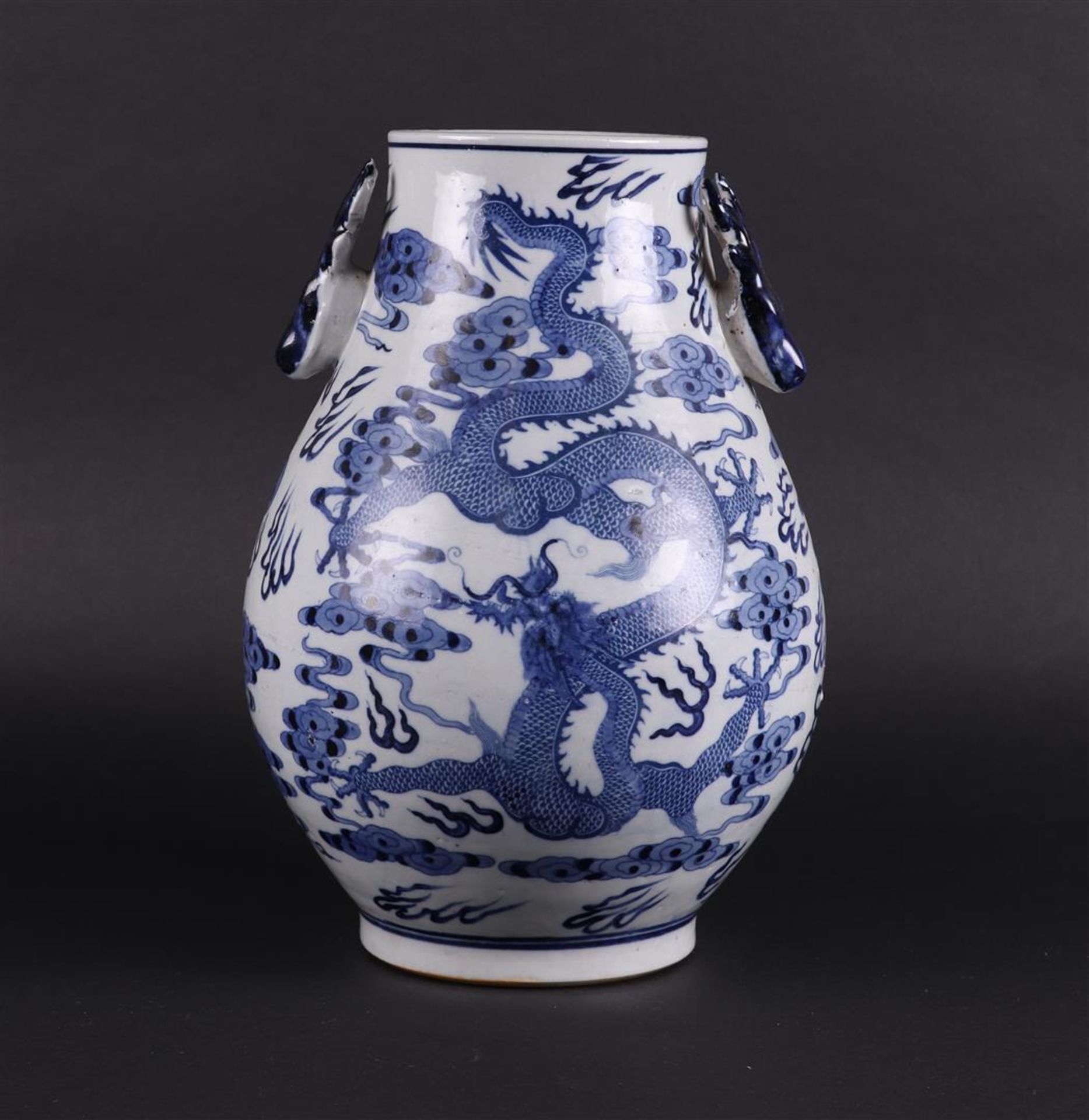 A porcelain 'Hu' vase decorated with dragons and deer heads, marked Guangxu. China, 20th century.