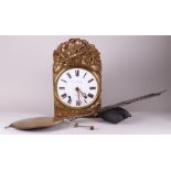 A French comtoise clock with laton copper decoration in the crest.