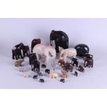 A collection of elephants in various materials.