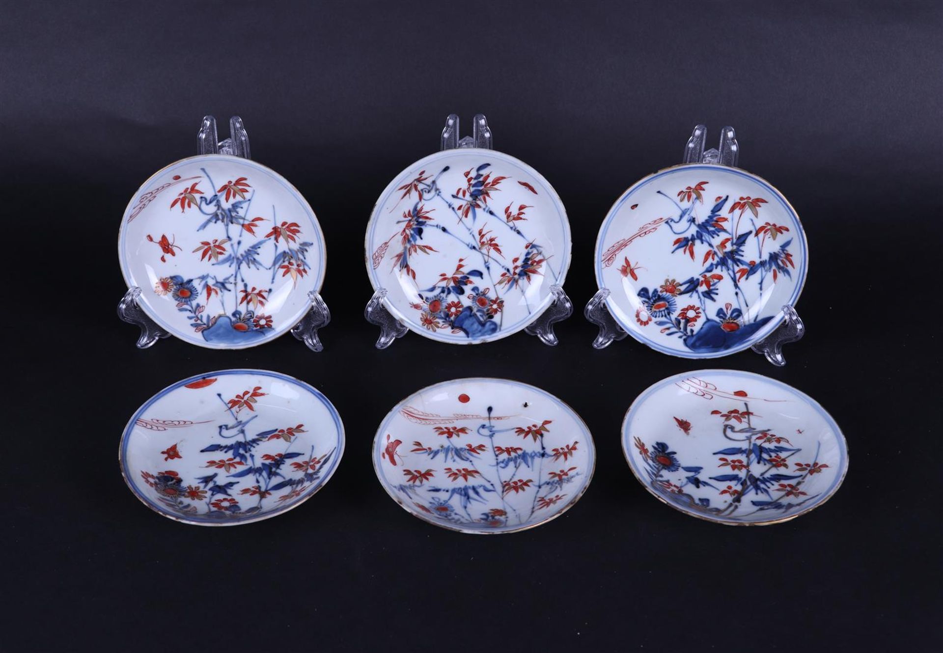 Six porcelain Imari plates with bird on bamboo branch and butterfly decor. China, Qianlong.