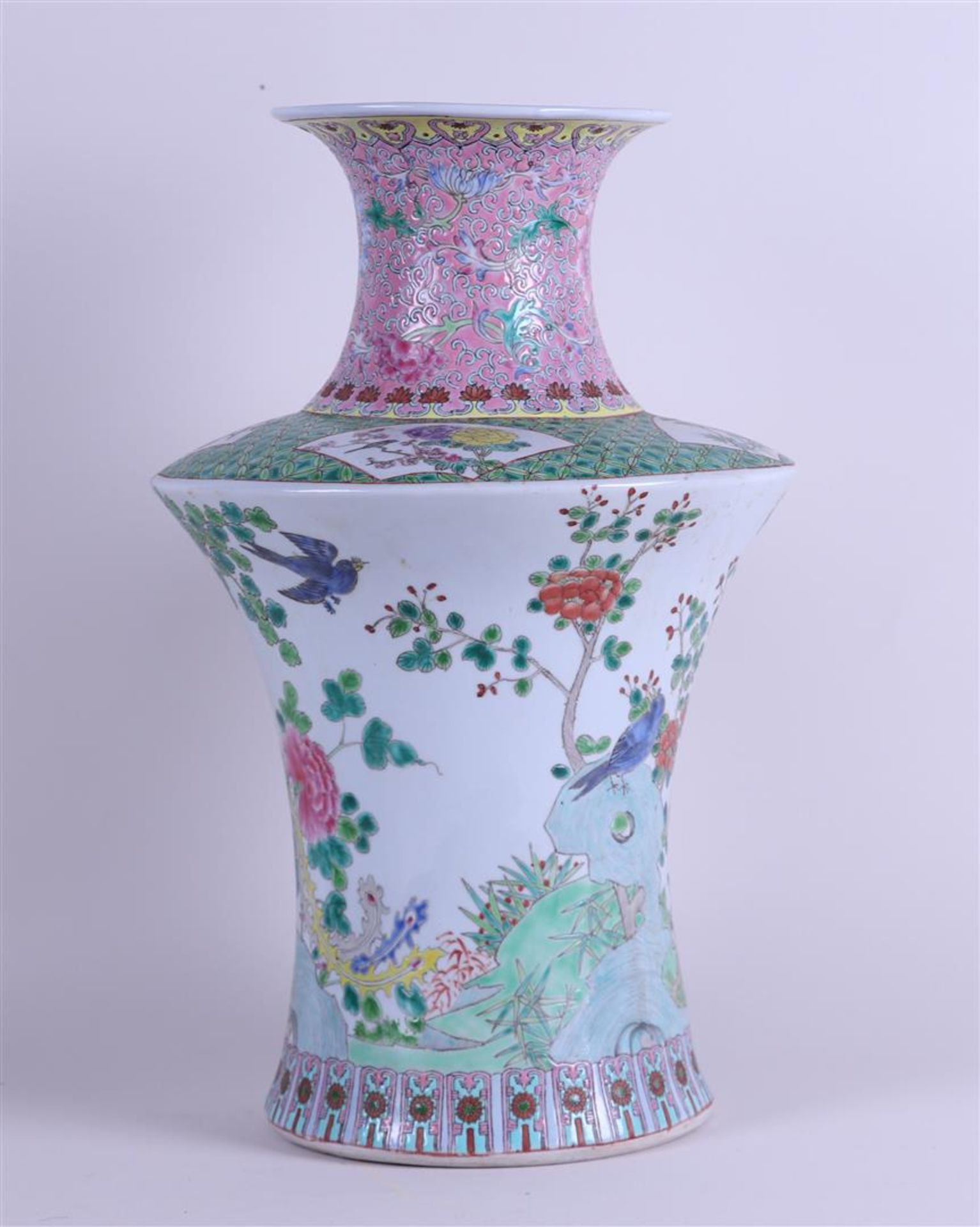 A porcelain Famile Rose vase decorated with various birds and flowers. China, 20th century.