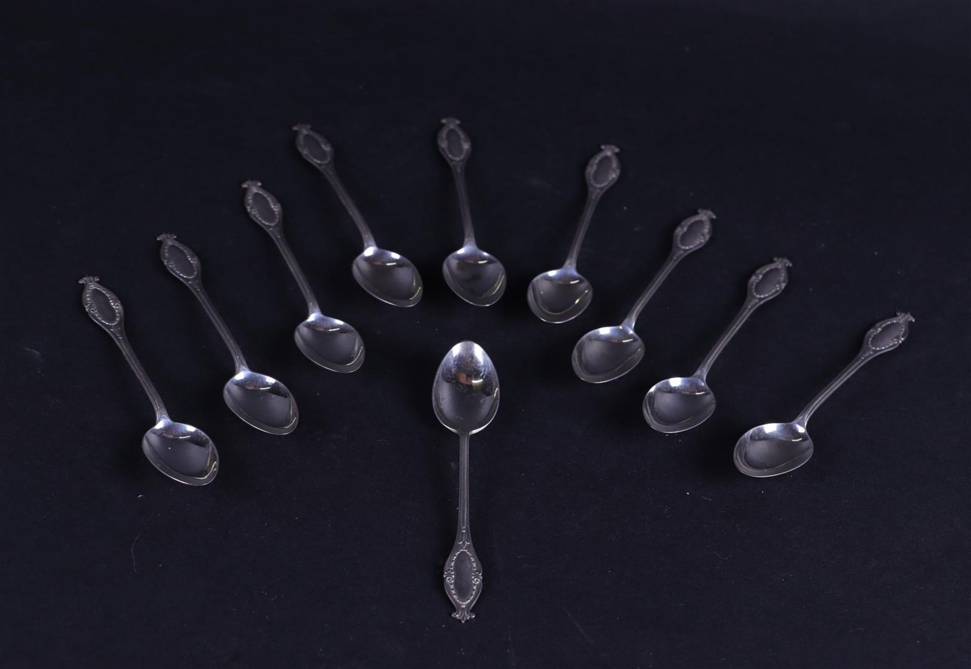 A set of silver teaspoons, marked with a sword 835/1000. 79 grams.