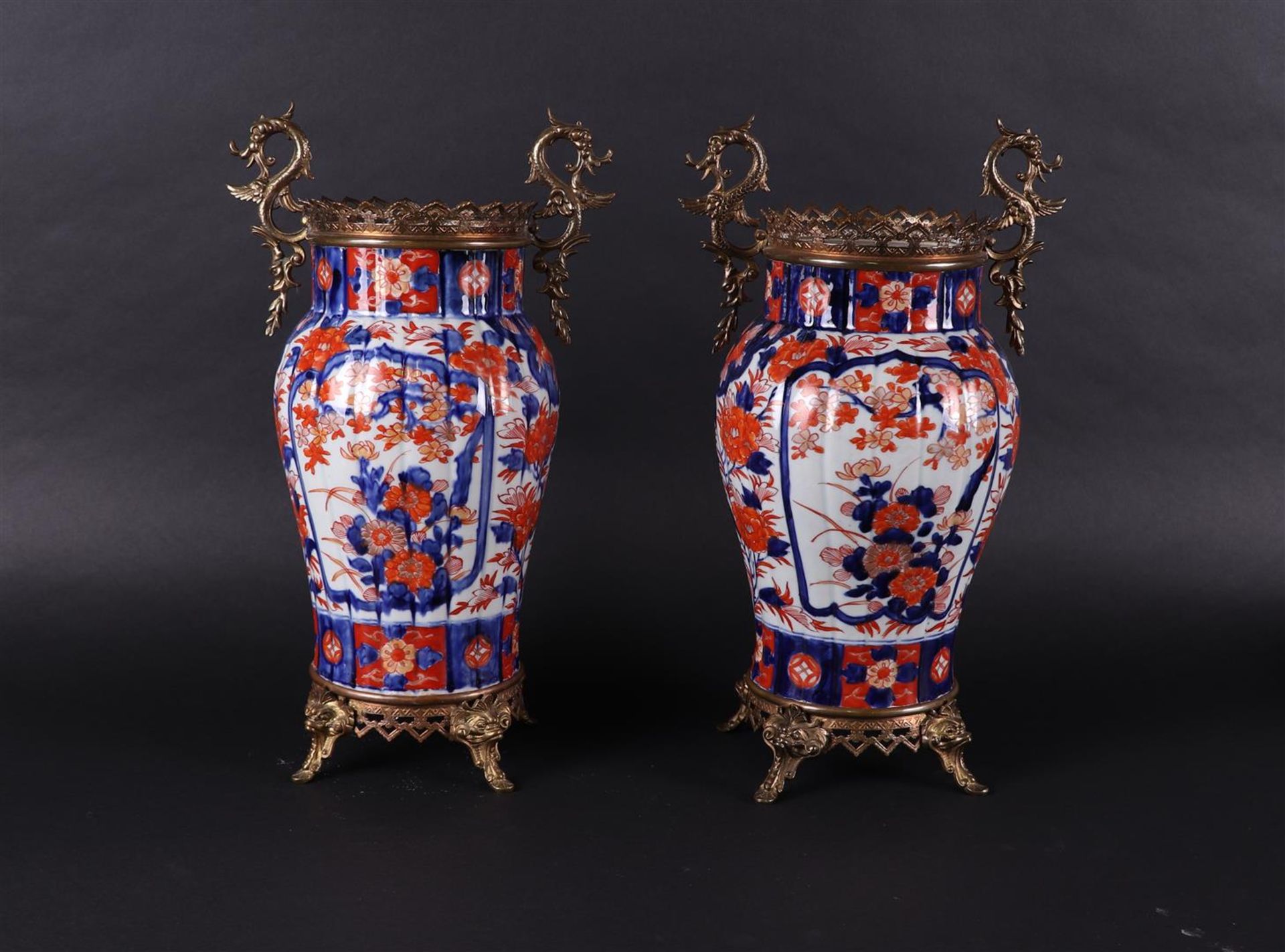 A set of two porcelain Imari vases with cast bronze mounts. Japan, 19th century.