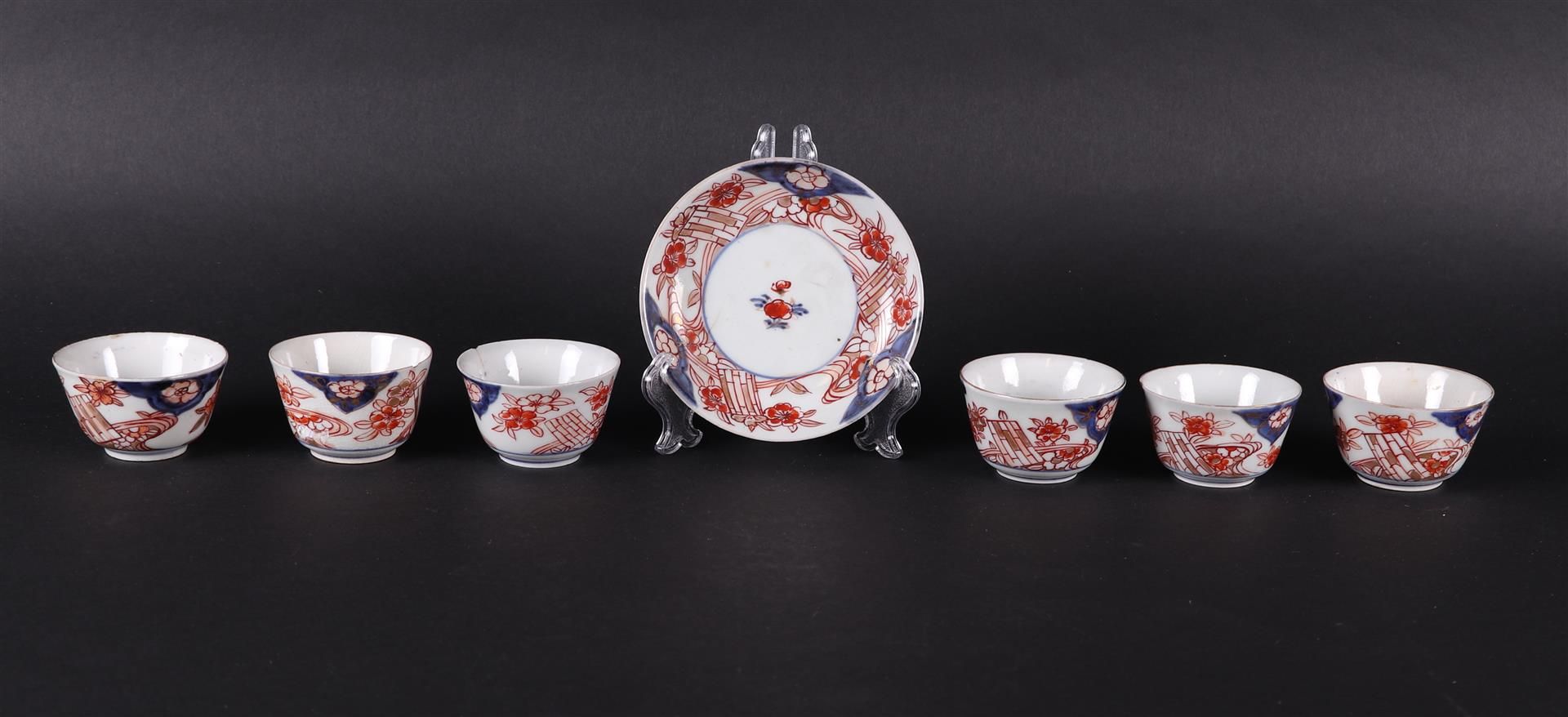 Six porcelain Imari bowls and one plate with a bamboo raft decor. Japan 18th century.