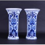 A set of two earthenware beaker vases, marked: "De Porceleyne Fles".
