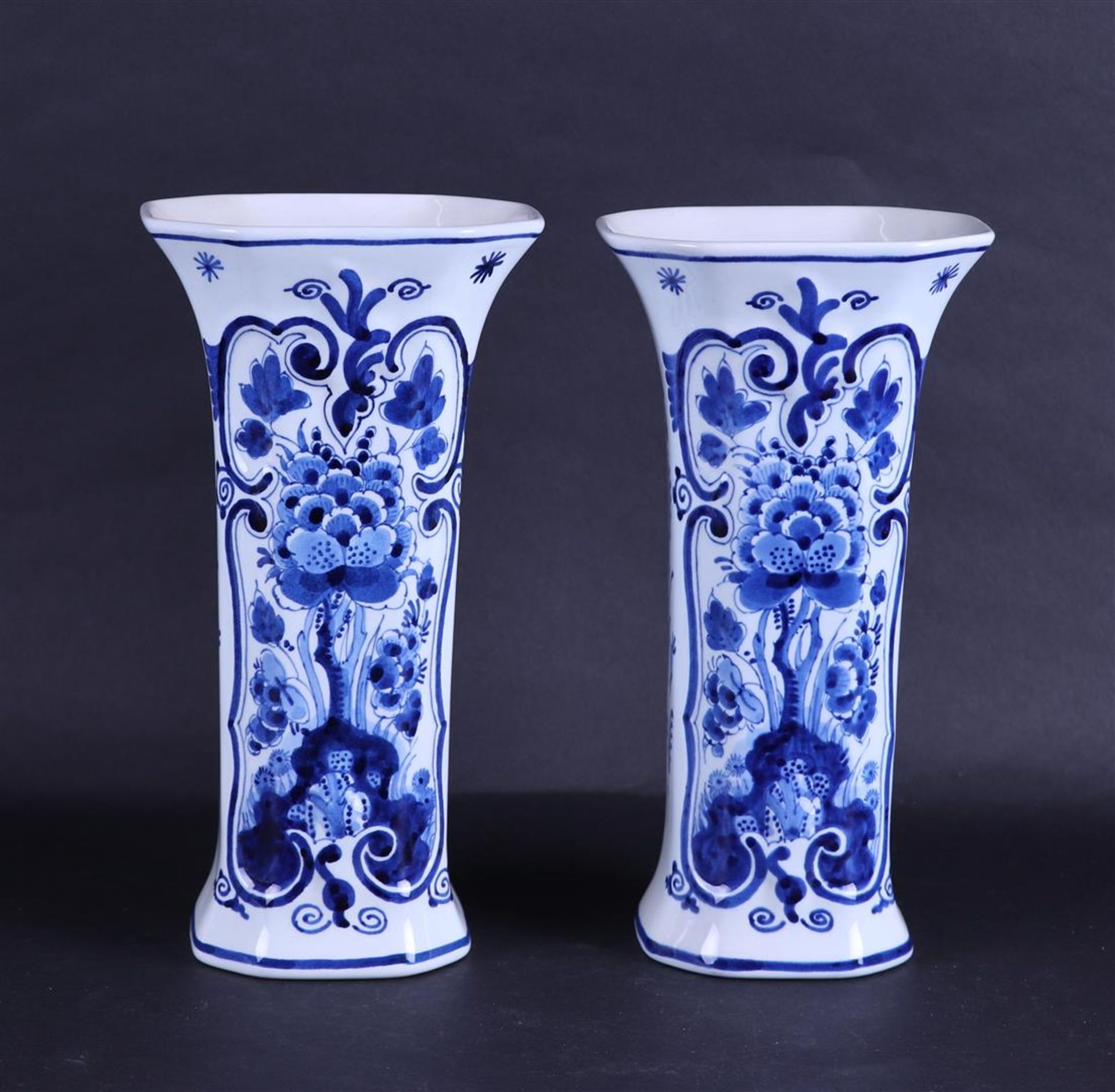 A set of two earthenware beaker vases, marked: "De Porceleyne Fles".