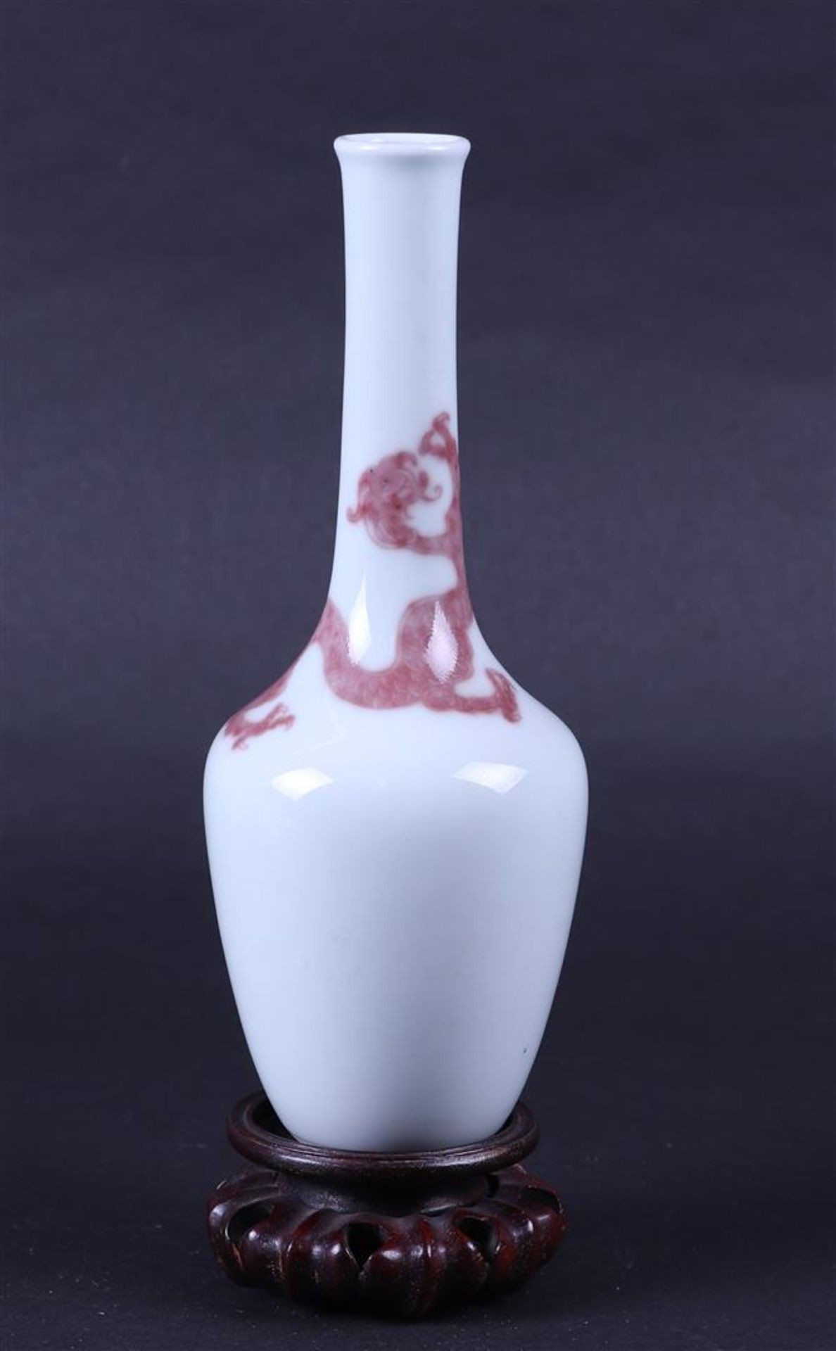 A porcelain pipe vase with Iron red decoration of a dragon, marked Kangxi. China, 19/20th century.