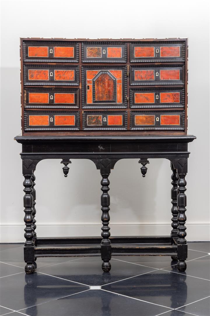 A mahogany glued so-called Flemish art cabinet, inlaid with bone. mounted on a later base 